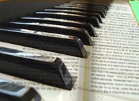 piano with book text superimposed